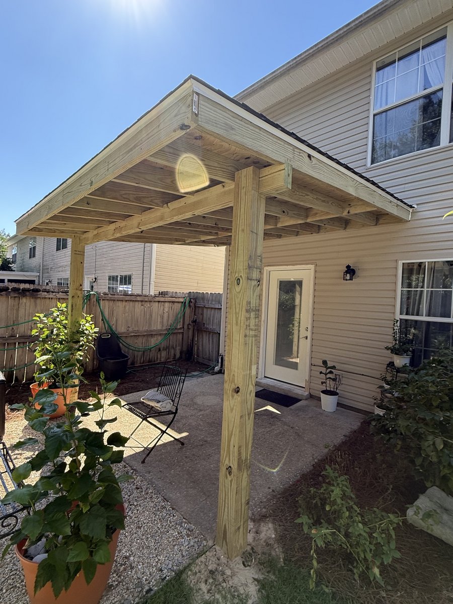 New wood patio cover built by KM over a concrete patio